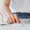 man-hand-counting-mortgage-discharge-fee